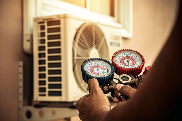 Professional Air Conditioning Service technician working in Louisa, VA
